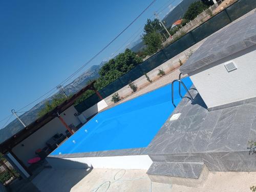 a swimming pool in the middle of a building at Apartments Calimero in Mostar