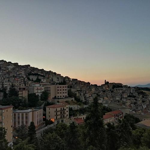a view of a city with buildings on a hill at CASA DIDYMA in San Giovanni Gemini