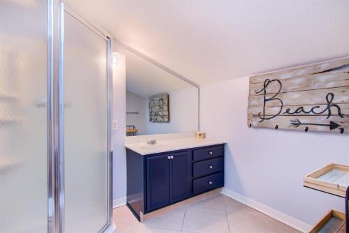 a bathroom with a sink and a shower at Isle Be Back in Destin