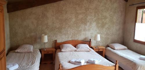 Postel nebo postele na pokoji v ubytování Auberge Les Myrtilles
