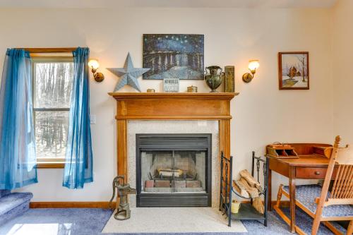 a living room with a fireplace with a star on the wall at Lake Wallenpaupack Summer Getaway with Pool Access! in Lake Ariel