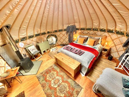 an overhead view of a bedroom in a yurt at Stamford Meadows Glamping in Stamford