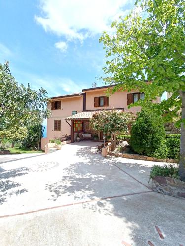 a large building with a driveway in front of it at LA Casa di Matilde in Gioiosa Marea