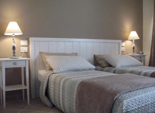 Postel nebo postele na pokoji v ubytování B&B Borgo Arcadia