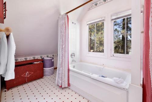 a bathroom with a tub and a window at JUS' RESTIN #265 in Big Bear Lake
