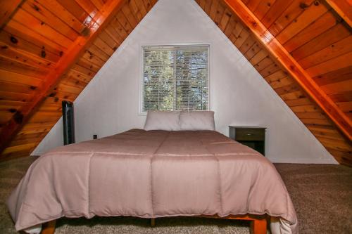 a bedroom with a large bed in a attic at Palms to pines #1877 in Sugarloaf