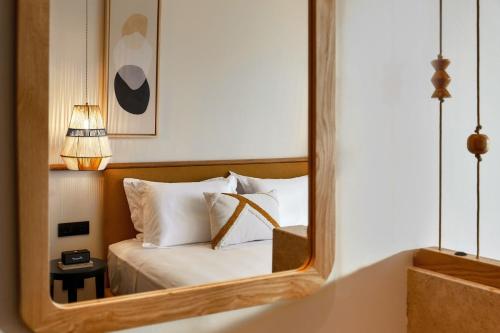 Un pat sau paturi într-o cameră la Alai Crete a Tribute Portfolio Resort