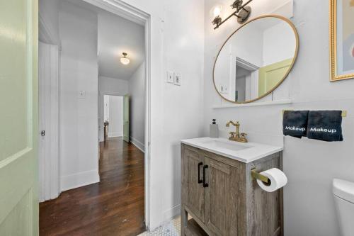 a bathroom with a sink and a mirror at Central Apt Near DT, Pearl, Breckenridge Park in San Antonio
