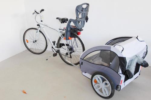 a bike parked next to a small car at Corte Attilea in Valeggio sul Mincio