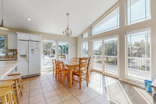 a kitchen and dining room with a table and chairs at Beach Escape in Rockaway Beach