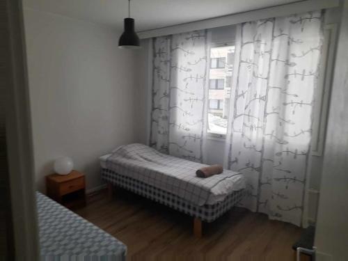 מיטה או מיטות בחדר ב-Liberty apartment Ilmarisentie20