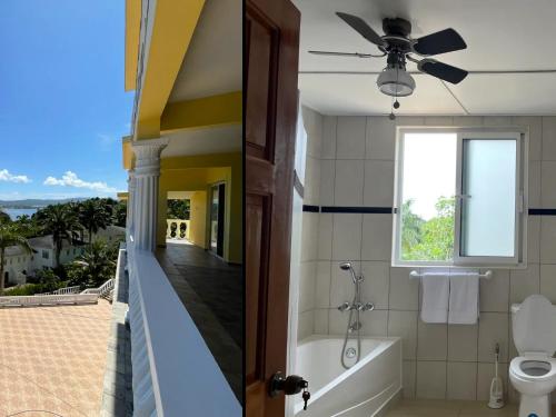 a bathroom with a tub and a toilet and a window at Spring Garden Mobay Resort in Montego Bay