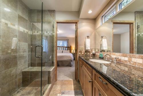 a bathroom with a glass shower and a sink at Carnelian Bay 4BD Near Beach & Slopes in Carnelian Bay