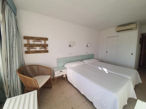 Postel nebo postele na pokoji v ubytování Hostal Roberto