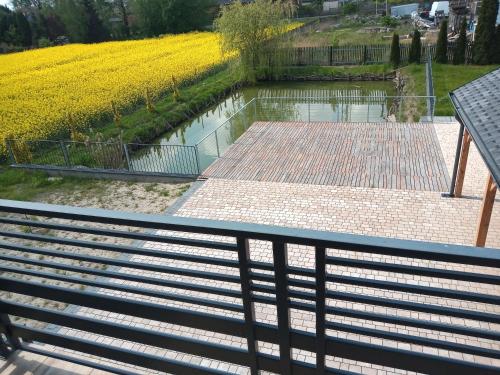 a view from the top of a walkway looking down at a river at SielAnka in Uniejow