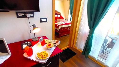 a room with a table with food on it at Chan Beach Resort & Hotel in Bahūr