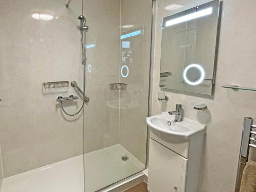 a bathroom with a shower and a sink at 1 Bed in Tenby 89847 in Penally
