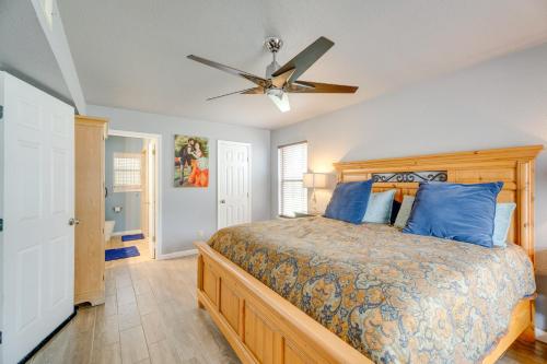 a bedroom with a bed and a ceiling fan at Family-Friendly San Antonio Getaway with Fire Pit! in San Antonio