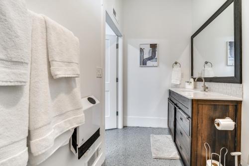 a bathroom with a sink and a mirror at Pasco Studio Vacation Rental with Private Patio! in Pasco