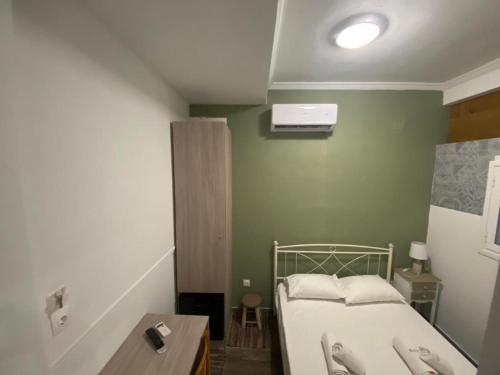 מיטה או מיטות בחדר ב-CASA KIRKI