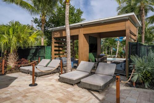 a patio with chairs and a gazebo at Hyatt Regency Coconut Point Resort & Spa Near Naples in Bonita Springs
