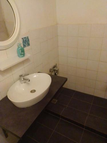 a bathroom with a sink and a mirror at Anemos Studios in Vassilias