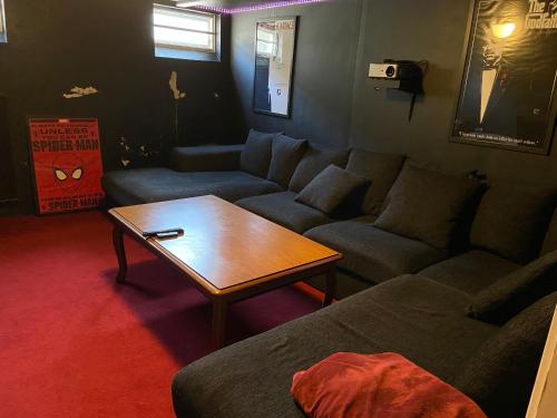 a living room with a couch and a coffee table at The Basement in Malmö