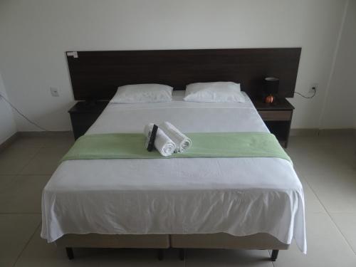 Una cama o camas en una habitación de Hotel Vilas