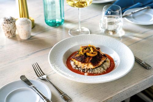 a white plate of food on a table at Hyatt Regency Coconut Point Resort & Spa Near Naples in Bonita Springs