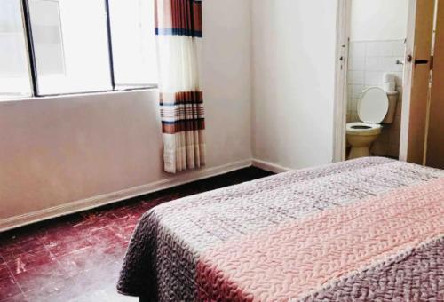 Un pat sau paturi într-o cameră la Smart Apart Miraflores