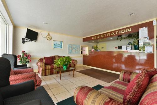 a hospital waiting room with chairs and a reception desk at Americas Best Value Inn Suites South Boston in South Boston