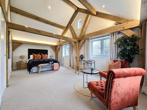 a bedroom with a bed in a room with wooden ceilings at 4BR Country Home Near Cider Barn & Brewery in Axbridge
