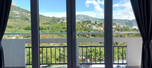 a window with a view of a mountain at Ana Marija in Solin
