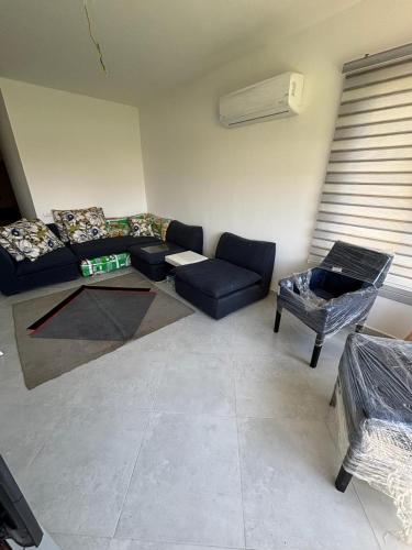 a living room with a couch and a table at Ain Bay Sokhna in Suez