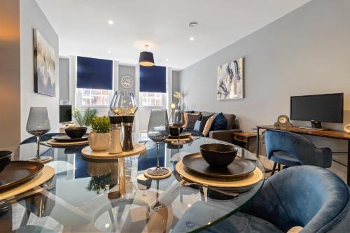 a living room with a glass table and chairs at WhiskAwayStays - Victoria House - Apartment 3 in Worcester