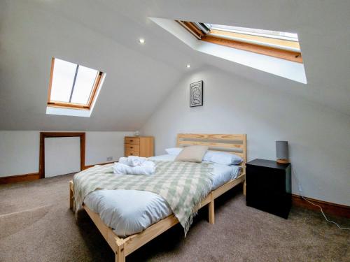 a bedroom with a bed in a attic at Peaceful 4 bed townhouse in Brighton & Hove