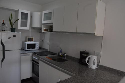 Virtuvė arba virtuvėlė apgyvendinimo įstaigoje @juanbjustoapartamento