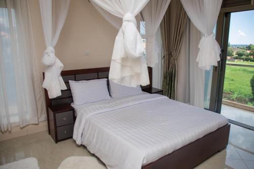Voodi või voodid majutusasutuse Munyonyo serviced apartments toas