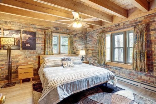a bedroom with a bed and a ceiling fan at Treehouse-Style Cabin, 1 Mi to Massanutten Resort in McGaheysville