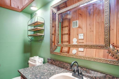a bathroom with a mirror and a sink at Treehouse-Style Cabin, 1 Mi to Massanutten Resort in McGaheysville