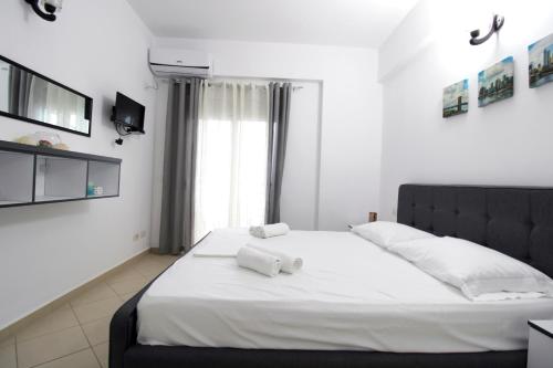 Postel nebo postele na pokoji v ubytování Appartamenti Vista Mare Saranda