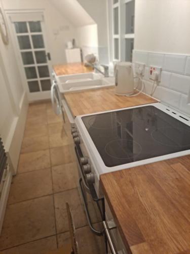 a kitchen with a sink and a counter top at Lapley Manor Lodge in Gailey