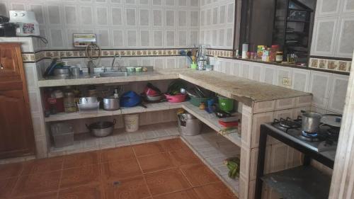 a kitchen with a counter with pots and pans at MINIMO 3 NOCHES HABITACION APARTAMENTO COMPARTIDO 3 PERSONAS - Aire acondicionado in Valledupar