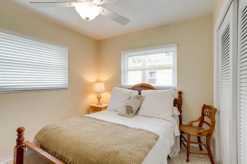 a bedroom with a bed and a ceiling fan at St Pete Beach Retreat about 5 Mi to Sunset Beach Bar in St Pete Beach