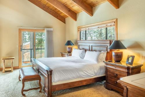 a bedroom with a large bed and a window at Frosted Shore by AvantStay Luxury Lake Views in Incline Village