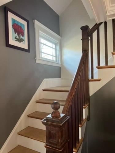 a staircase in a home with a stair case at Jersey St Lovely in Marblehead