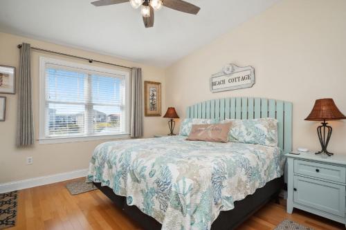 a bedroom with a bed and a window at Sea Tales in Oak Island