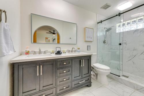 a bathroom with a sink and a shower and a toilet at Spacious Desert Oasis in Mesa with Private Pool! in Mesa