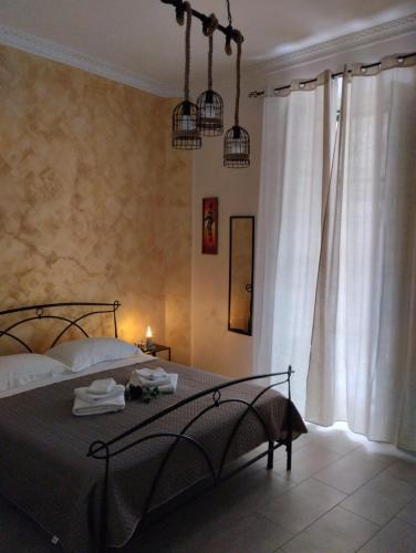a bedroom with a bed and a window at La ninfa B&B in Salerno
