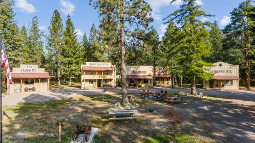 an aerial view of a building with trees at Fort Williamson Glacier Vacation Rentals in Columbia Falls